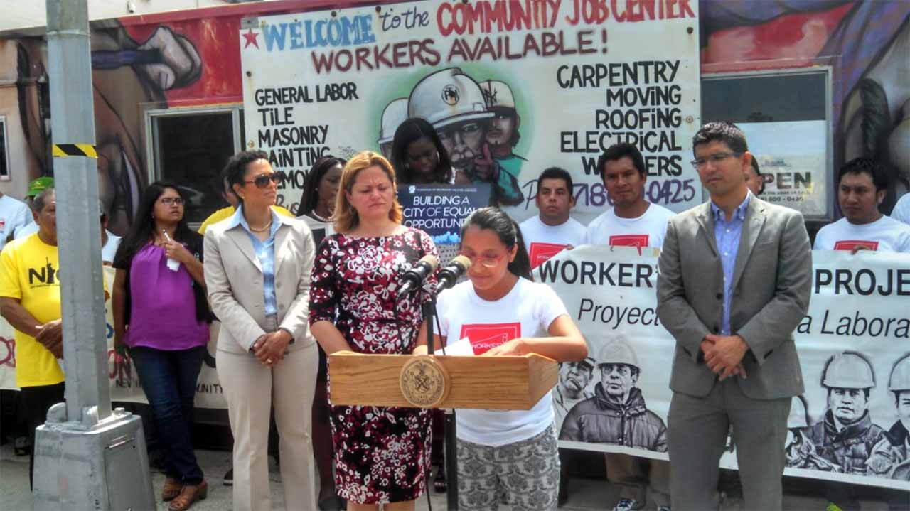 young protester speaking at workers rally in nyc