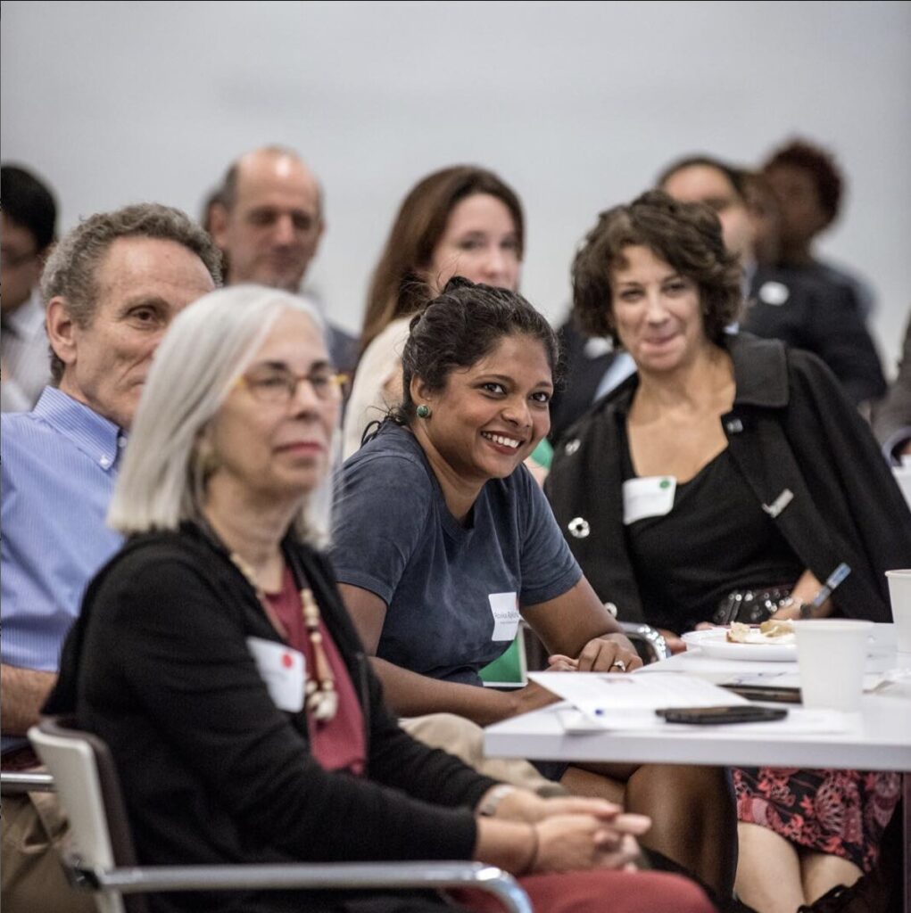 smiling group at historic racial justice proposal in nyc