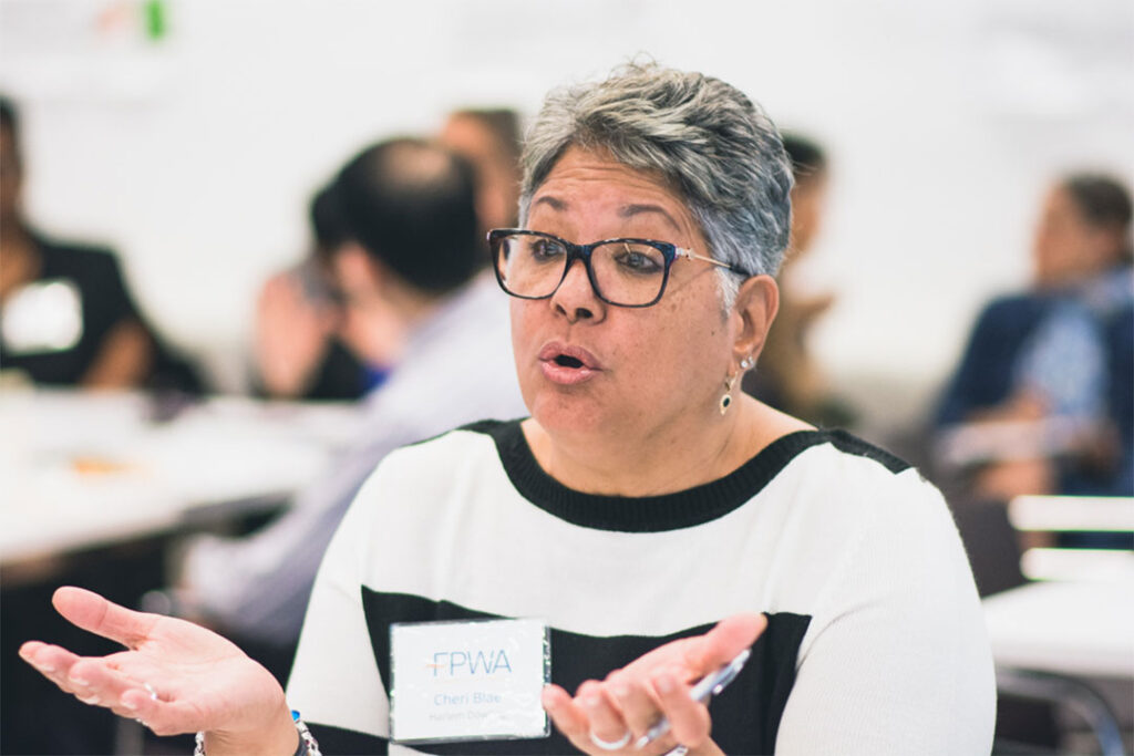 portrait of FPWA member speaking at an event