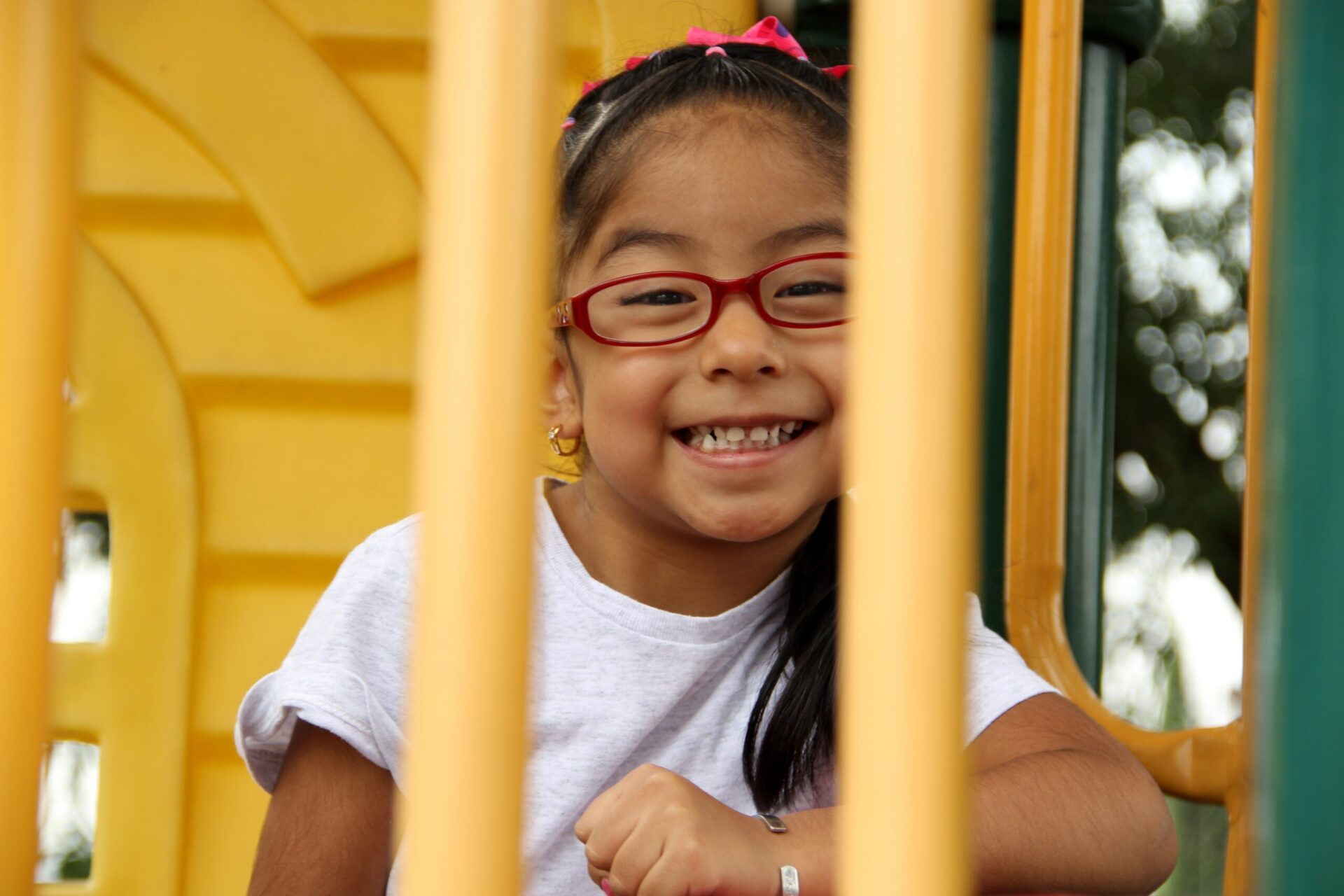 young child smiling on playground